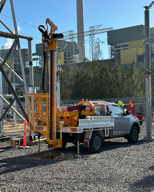 Ute-mounted drilling rig operating on a restricted-access site